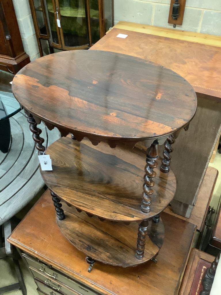 A Victorian rosewood oval three tier whatnot, width 48cm, depth 34cm, height 81cm